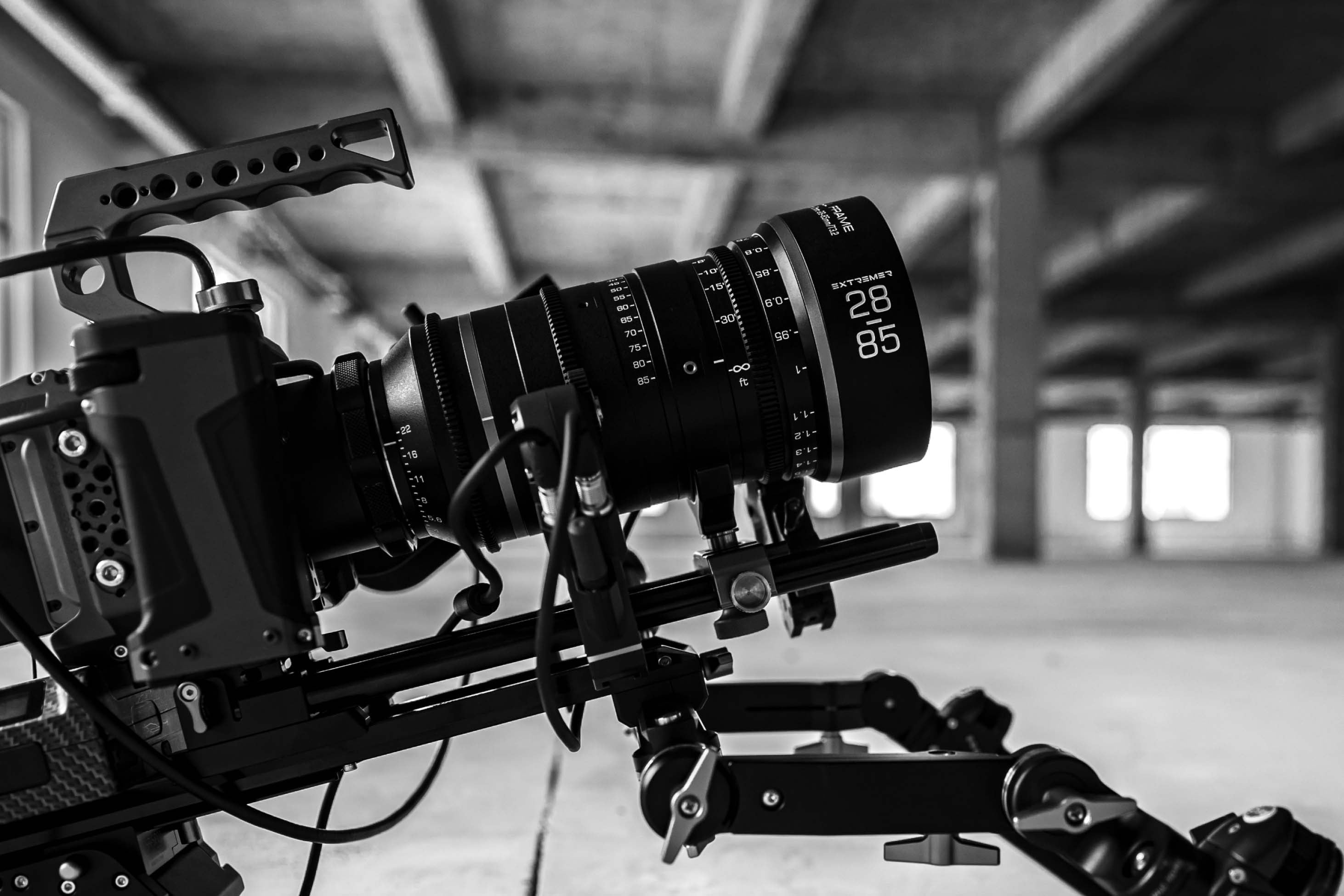 Chiopt Extreme Zoom 28-85mm T3.2 cinema lens close-up, featuring precision focus and zoom rings, engraved focal length markings, and durable all-metal construction. Ideal for high-resolution 8K production