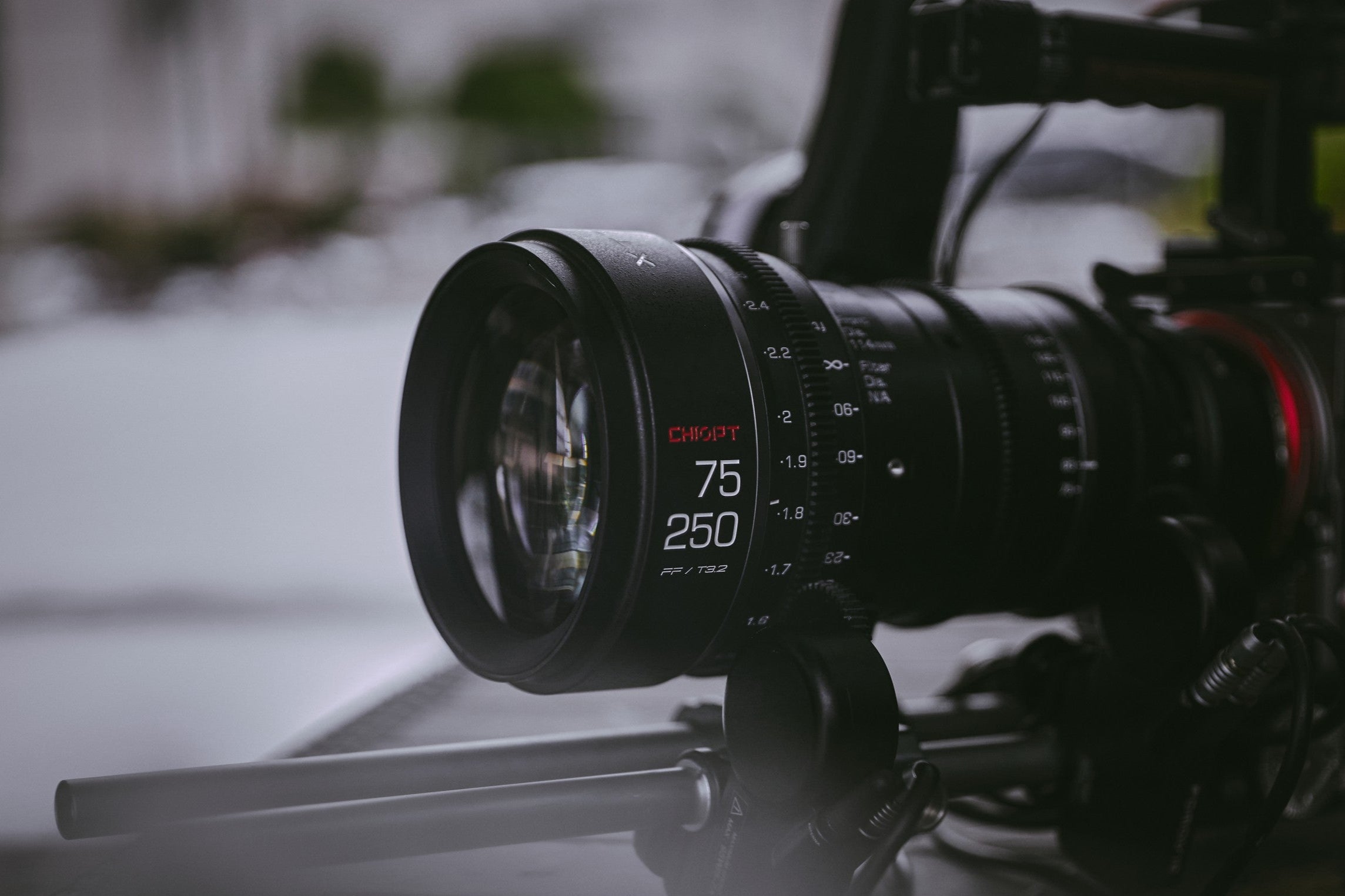 Close-up banner of Chiopt Xtreme Zoom 75-250mm cine lens showcasing precision craftsmanship, versatile zoom range, and superior image quality for professional cinematography and video production. Ideal for documentary filmmakers, wildlife videographers, sports videography, and outdoor adventure shooting.