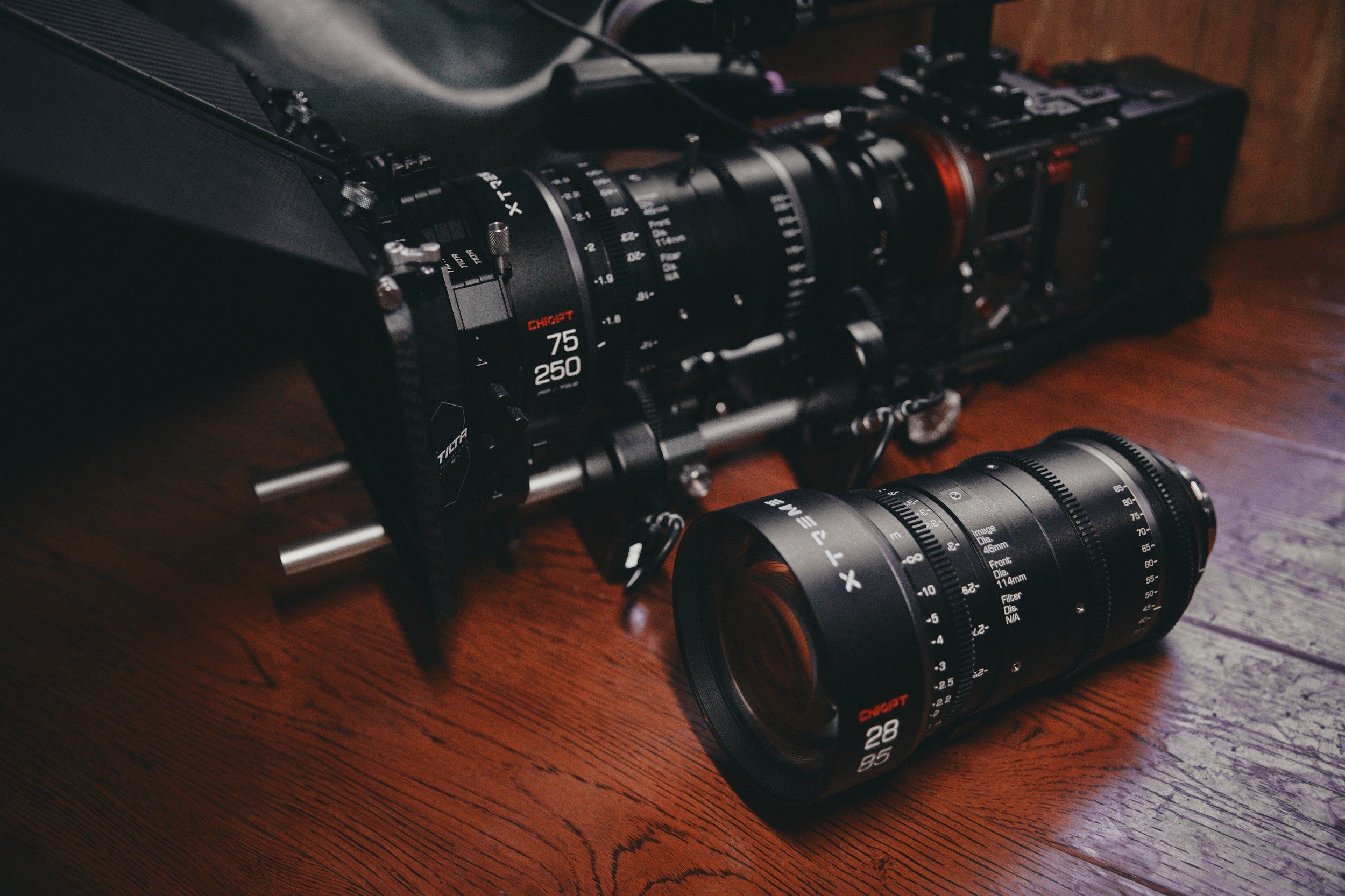 Chiopt Xtreme Zoom Lens black kit with secure reinforced flight case, featuring classic 28-85mm T3.2 and 75-250mm T3.2 cine lenses, offering versatile zoom ranges and superior optical performance, the best choice for professional filmmakers seeking high-quality zoom lens solutions.