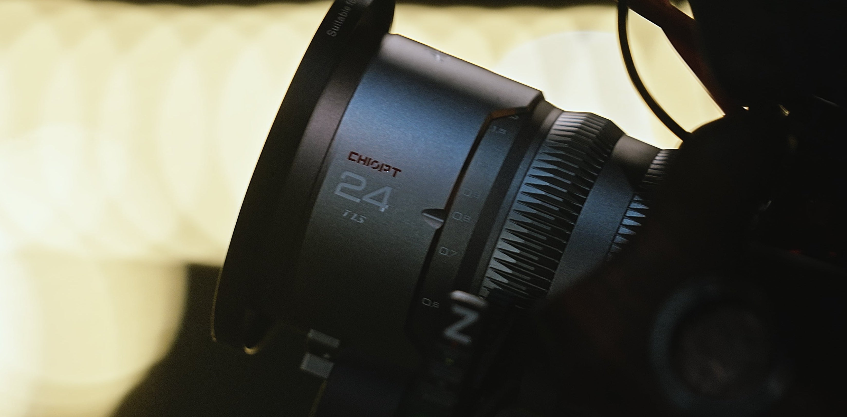Chiopt Aura 24mm lens in use on handheld rig for street cinematography