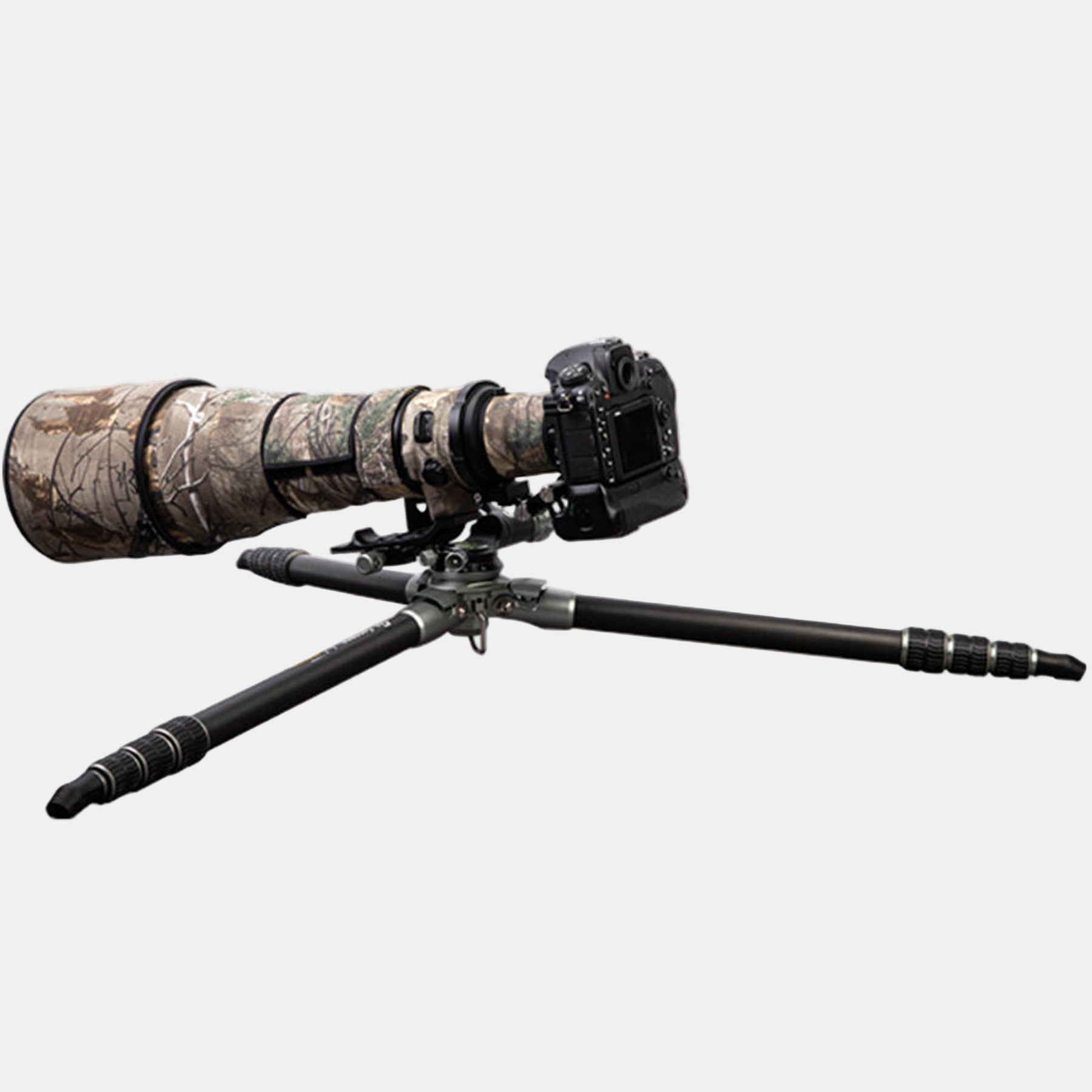 Fotopro E7 heavy-duty tripod fully extended for low-angle shooting, legs spread almost flat for ground-level photography, ideal for macro, wildlife, and bird photography in uneven or rugged terrain.