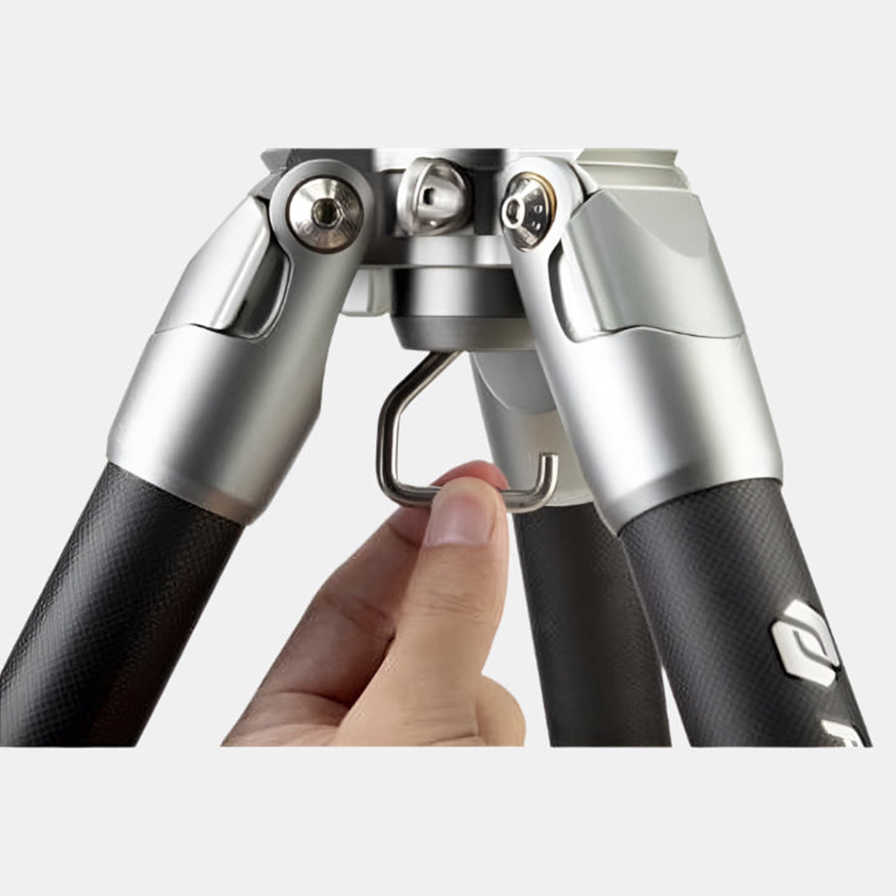 Fotopro E7 carbon fiber tripod with hidden stability hook to hang extra weights, enhancing tripod stability in outdoor environments, perfect for birdwatching, wildlife, and panoramic photography.