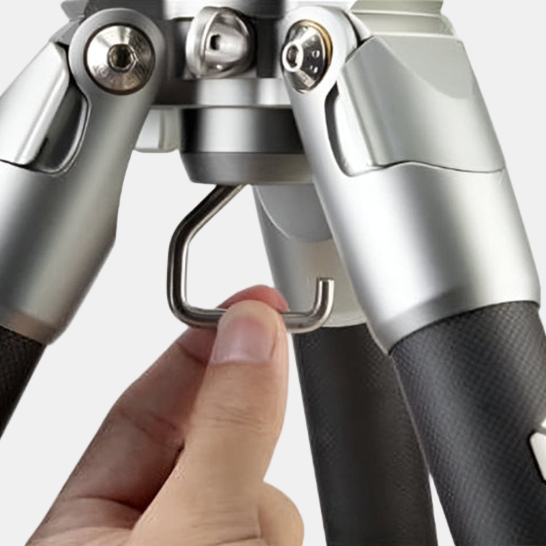 Fotopro E7 carbon fiber tripod with hidden stability hook to hang extra weights, enhancing tripod stability in outdoor environments, perfect for birdwatching, wildlife, and panoramic photography.