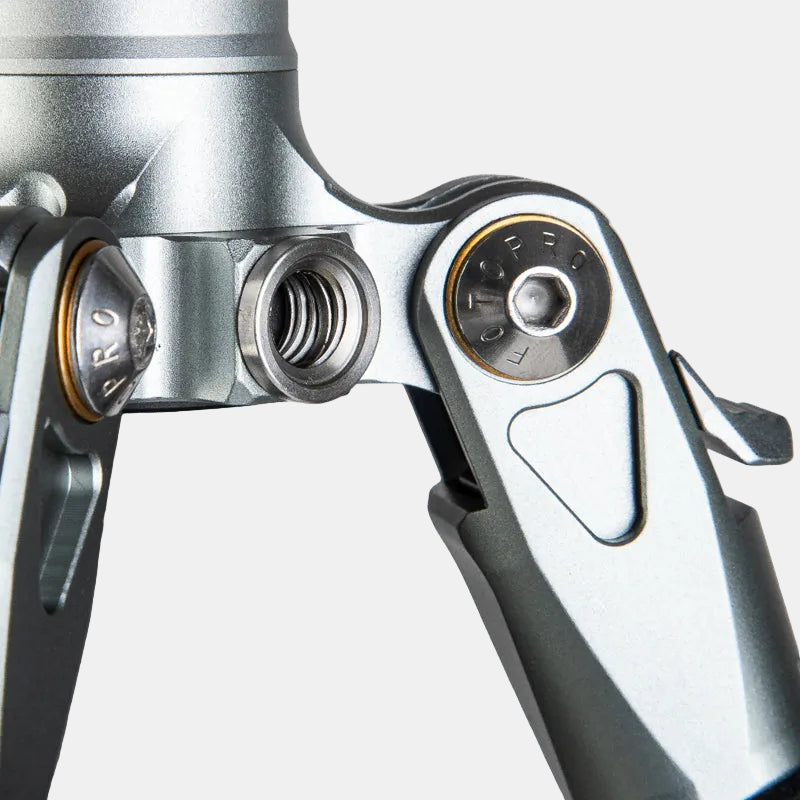 Close-up of the 3/8-inch accessory hole on the Fotopro T-ROC tripod, designed for securely mounting external devices such as microphones, lights, or monitors, showcasing versatile gear setup for professional photography and videography.