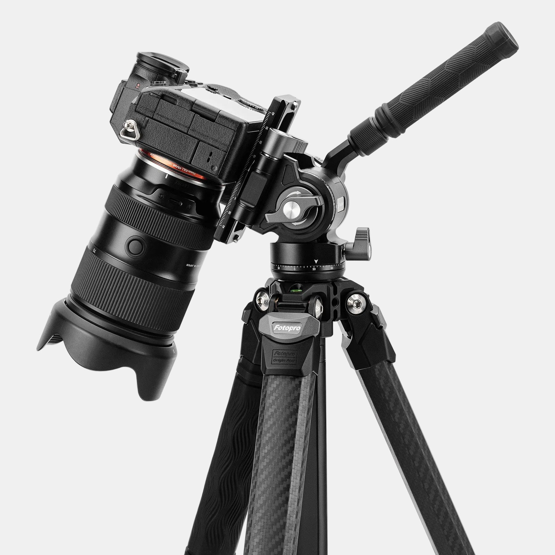 Fotopro Origin plus lightweight carbon fiber tripod equipped with MH-6a pro professional fluid video head with handle for easy and smooth tilt and pan movements, perfect for vertical video shooting and cinematic video production.