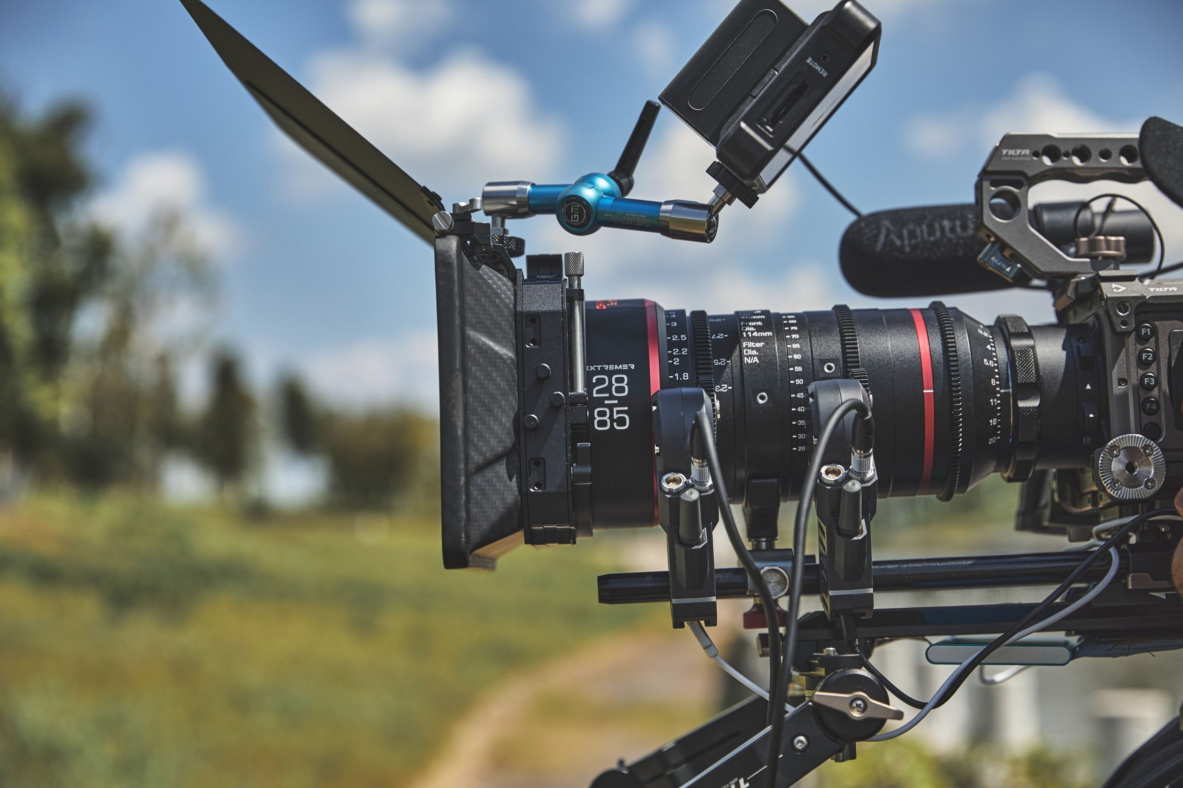 Chiopt Xtreme Zoom 28-85mm T3.2 cine lens equipped with follow focus, and filters, designed for professional filmmakers seeking versatile and precise control in cinematic video production.