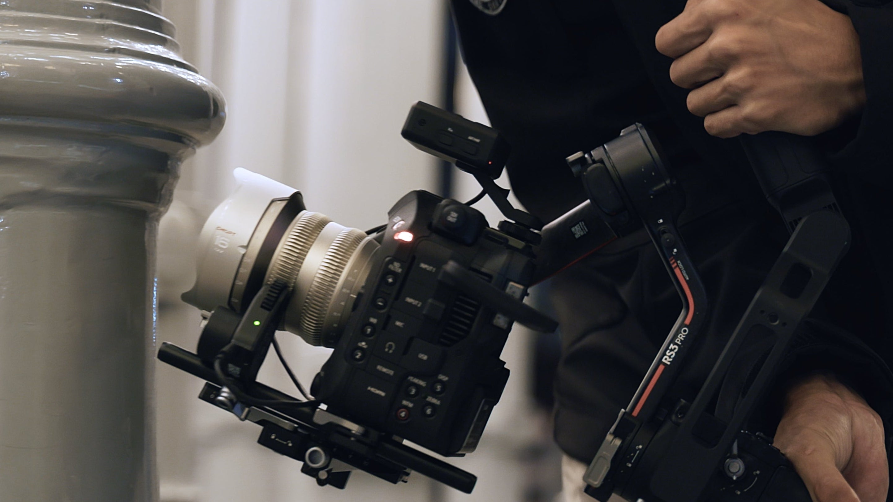Chiopt Aura lightweight cine lens used in handheld setup for mobile filmmaking and run-and-gun shooting