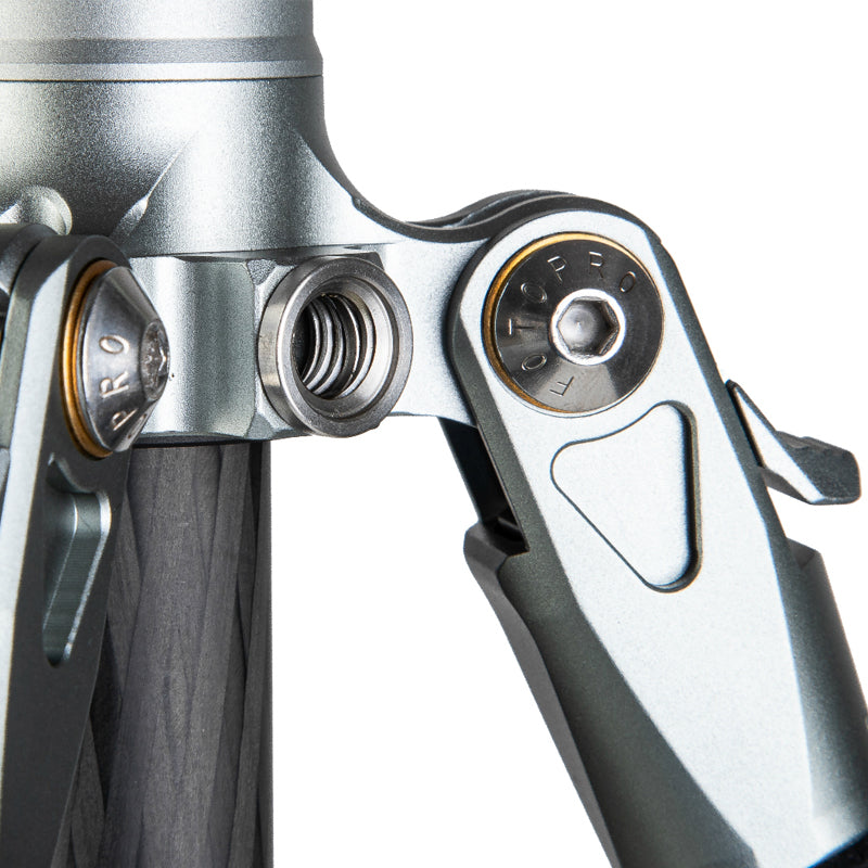 Close-up of the 3/8-inch accessory hole on the Fotopro T-ROC tripod, designed for securely mounting external devices such as microphones, lights, or monitors, showcasing versatile gear setup for professional photography and videography.