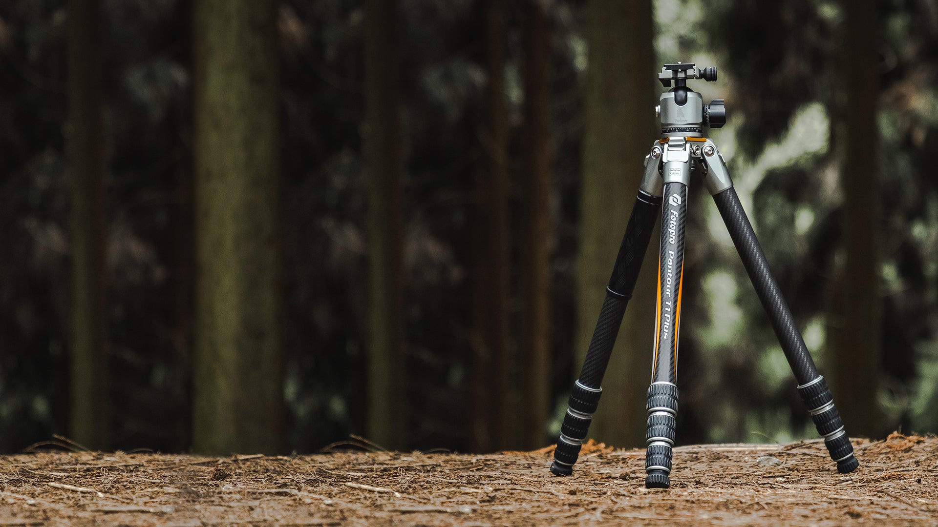 Fotopro T1 Plus carbon fiber camera tripod banner showcasing the ultimate all-terrain tripod. A dependable, lightweight, and stable camera tripod for any adventure, perfectly adaptable to forests, wilderness, beaches, deserts, snow, rocky landscapes, and extreme outdoor environments. Ideal for photographers and filmmakers seeking versatile, rugged tripods.
