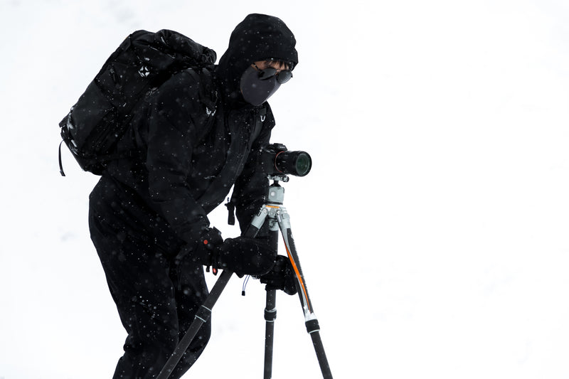 Fotopro T1 Plus camera tripod for travel in snow and ice environments, featuring anti-slip 6-claw spikes, anti-freeze materials, lightweight for carrying, and stable support for outdoor winter photography, wildlife, and sports shooting in cold weather.