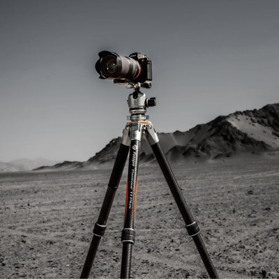 Fotopro Pantour T1 Plus T-Track carbon fiber travel camera tripod fully extended and working in extreme outdoor conditions. Dustproof, sandproof, and weather-resistant design, built for deserts, rocky ground, snow, and challenging environments. Perfect for photographers and videographers using DSLR, mirrorless, and cine cameras.